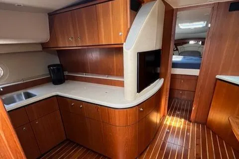  Yacht Photos Pics Luxurious 2007 Tiara Yachts 4300 Sovran interior with wood cabinetry and modern amenities.
