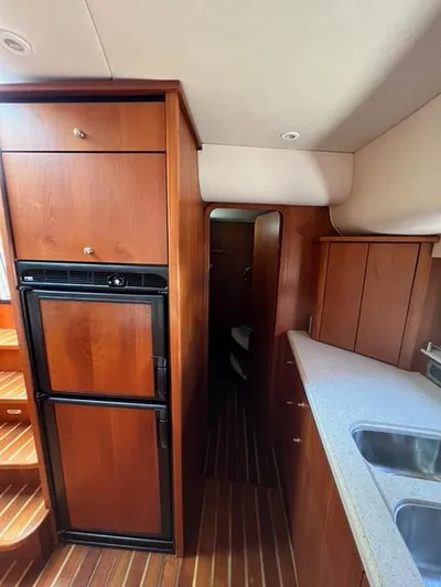  Yacht Photos Pics Interior of 2007 Tiara Yachts 4300 Sovran with wood cabinetry and modern kitchen.