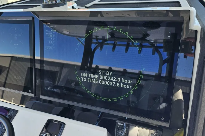  Yacht Photos Pics 2025 Costa Custom Boats 34ST dashboard with radar display and operational hours.