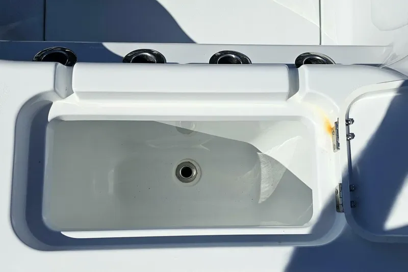  Yacht Photos Pics 2025 Costa Custom Boats 34ST livewell with rod holders, showcasing sleek design and functionality.