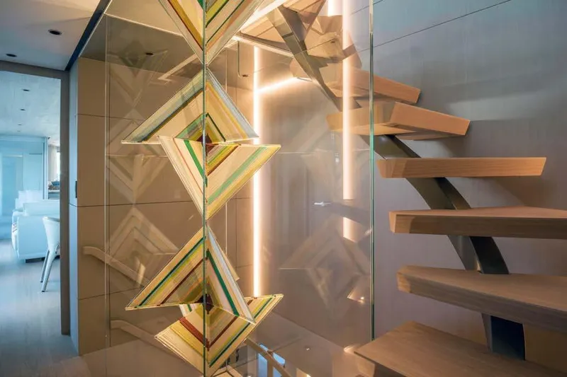 Stellamar Yacht Photos Pics Modern interior of 2023 Cantiere Delle Marche RJ 115 yacht with stylish staircase design.