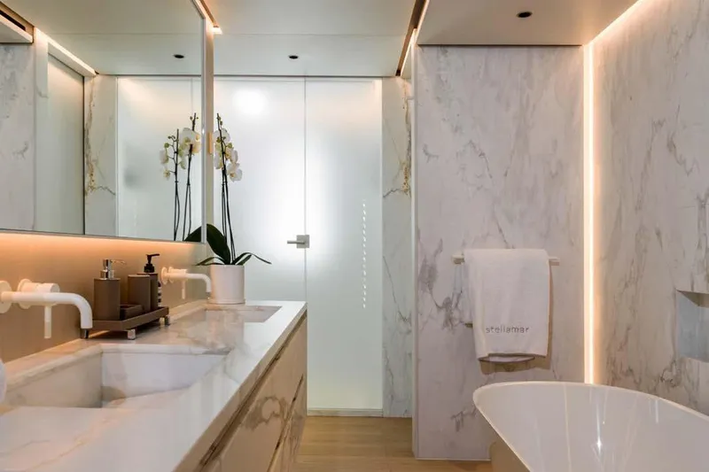 Stellamar Yacht Photos Pics Luxurious marble bathroom on 2023 Cantiere Delle Marche RJ 115 yacht, featuring elegant fixtures and decor.