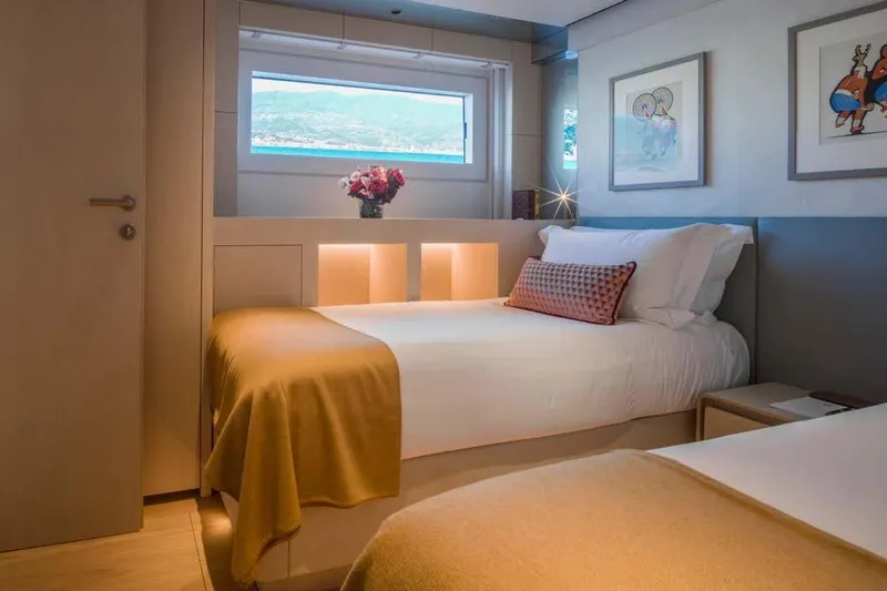 Stellamar Yacht Photos Pics Luxurious bedroom interior on 2023 Cantiere Delle Marche RJ 115 yacht, featuring elegant decor and window view.
