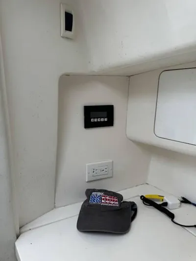 2003 Intrepid 31 Walkaround Yacht Photos Pics 2003 Intrepid 31 Walkaround cabin interior with control panel and accessories.