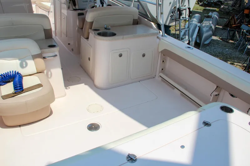 Marleon Yacht Photos Pics 2014 Grady-White Freedom 307 boat interior with seating and storage compartments.