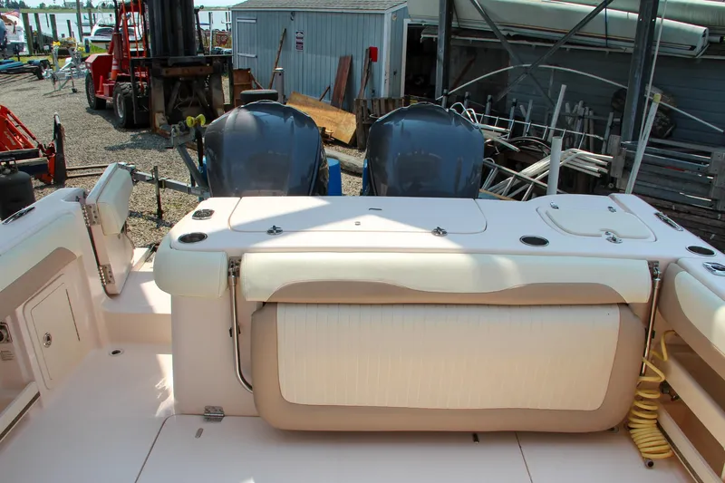 Marleon Yacht Photos Pics 2014 Grady-White Freedom 307 boat interior with dual engines in a marina setting.