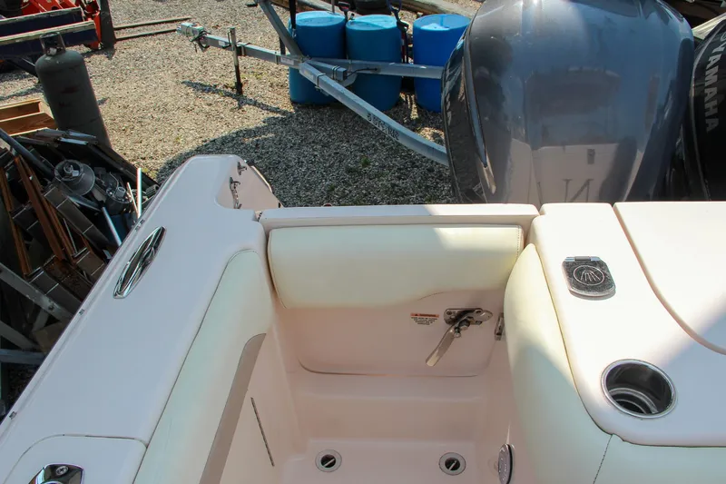 Marleon Yacht Photos Pics 2014 Grady-White Freedom 307 boat interior with engine and seating area.