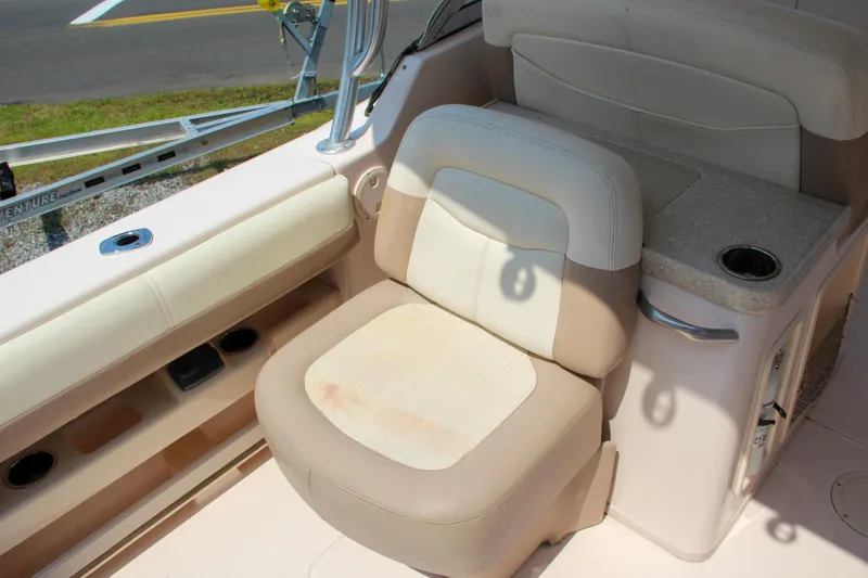 Marleon Yacht Photos Pics 2014 Grady-White Freedom 307 boat interior with beige seating and cup holder.