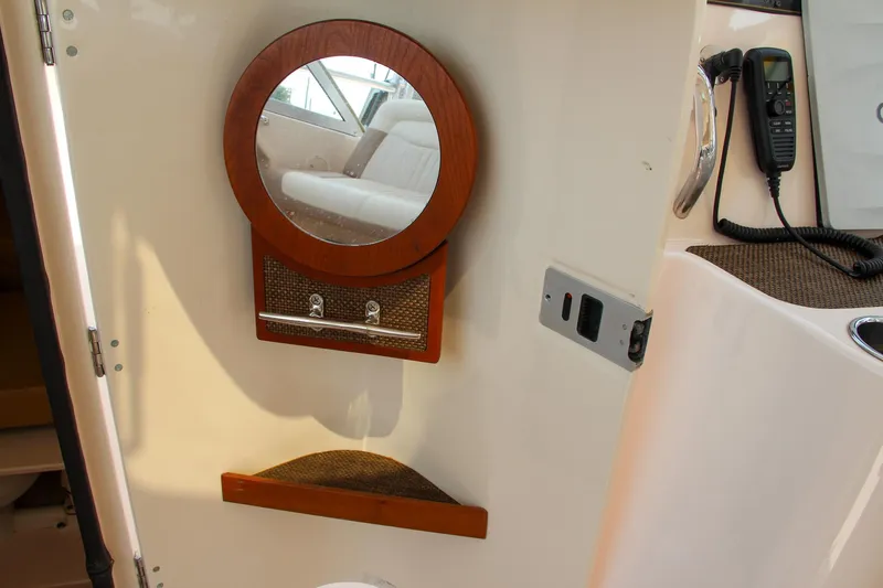 Marleon Yacht Photos Pics Interior of 2014 Grady-White Freedom 307 boat with mirror and radio.