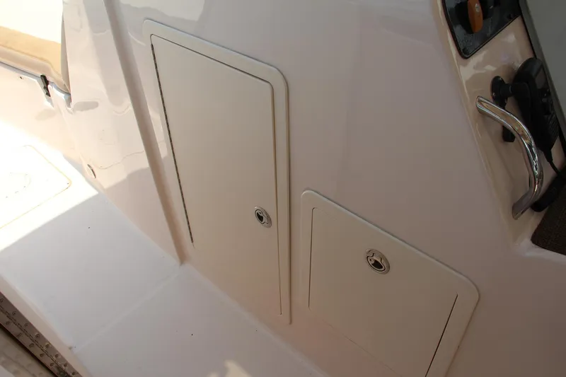 Marleon Yacht Photos Pics 2014 Grady-White Freedom 307 boat storage compartments and control panel.