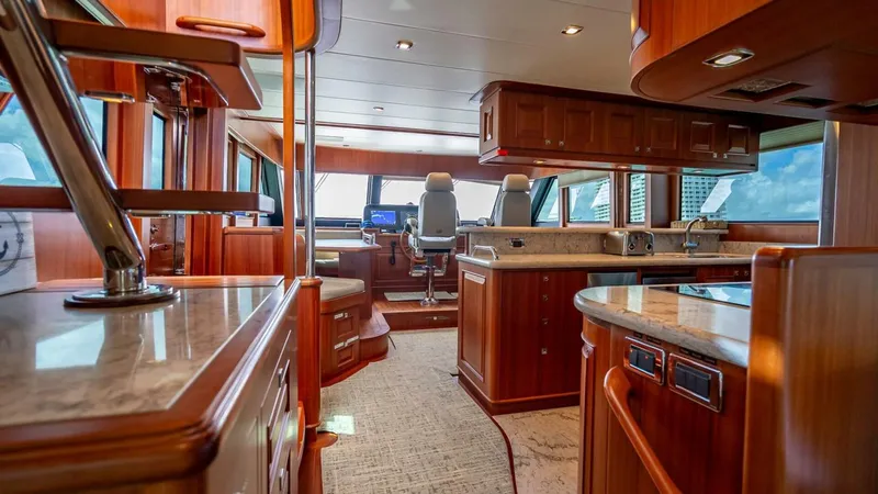 Sunny Seajay Yacht Photos Pics Luxurious interior of 2022 Hampton 658l Endurance yacht with modern helm and kitchen.