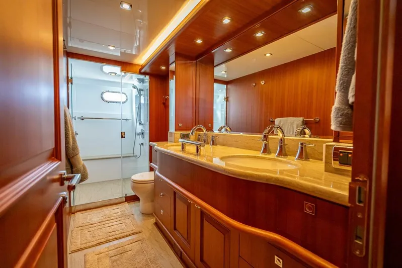 Sunny Seajay Yacht Photos Pics Luxurious bathroom in 2022 Hampton 658l Endurance yacht with wooden cabinetry and modern fixtures.