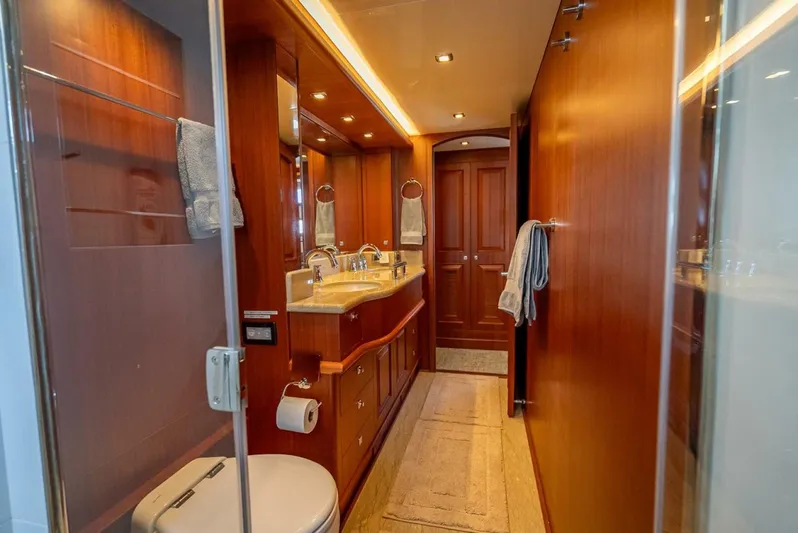 Sunny Seajay Yacht Photos Pics Luxurious bathroom in 2022 Hampton 658l Endurance yacht with wood finishes and modern fixtures.