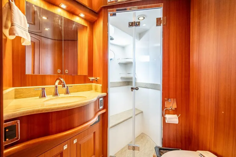 Sunny Seajay Yacht Photos Pics Luxurious bathroom in 2022 Hampton 658l Endurance yacht with wood finish and modern fixtures.