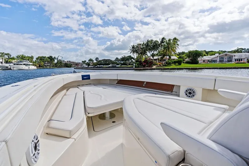 Acevedo Yacht Photos Pics 2016 Hydrosport Siesta boat interior with luxurious seating, cruising on a scenic waterway.