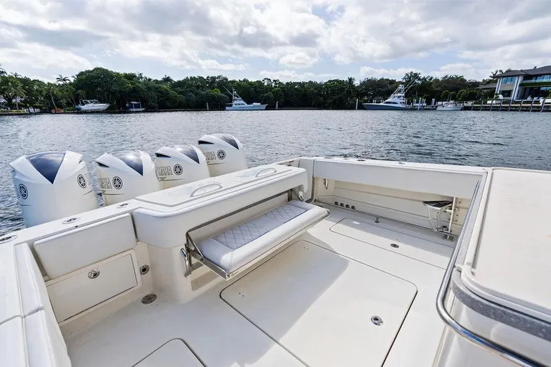 Acevedo Yacht Photos Pics 2016 Hydrosport Siesta boat with multiple outboard engines on a calm waterway.
