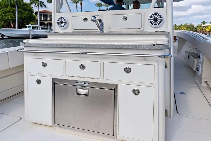 Acevedo Yacht Photos Pics 2016 Hydrosport Siesta boat kitchen with stainless steel appliances and storage drawers.