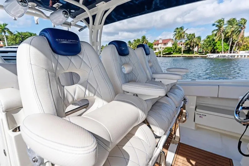 Acevedo Yacht Photos Pics Luxurious seating on a 2016 Hydrosport Siesta boat, with scenic waterfront view.