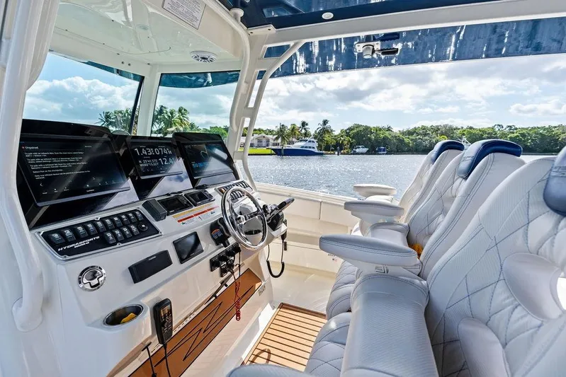 Acevedo Yacht Photos Pics Interior of 2016 Hydrosport Siesta boat with luxurious seating and advanced navigation controls.