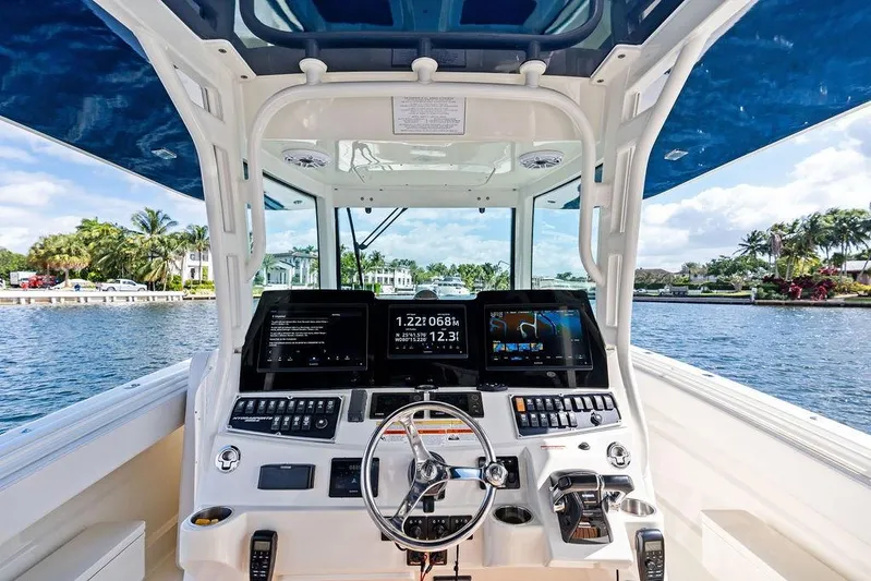 Acevedo Yacht Photos Pics 2016 Hydrosport Siesta boat cockpit with advanced navigation system on a sunny day.
