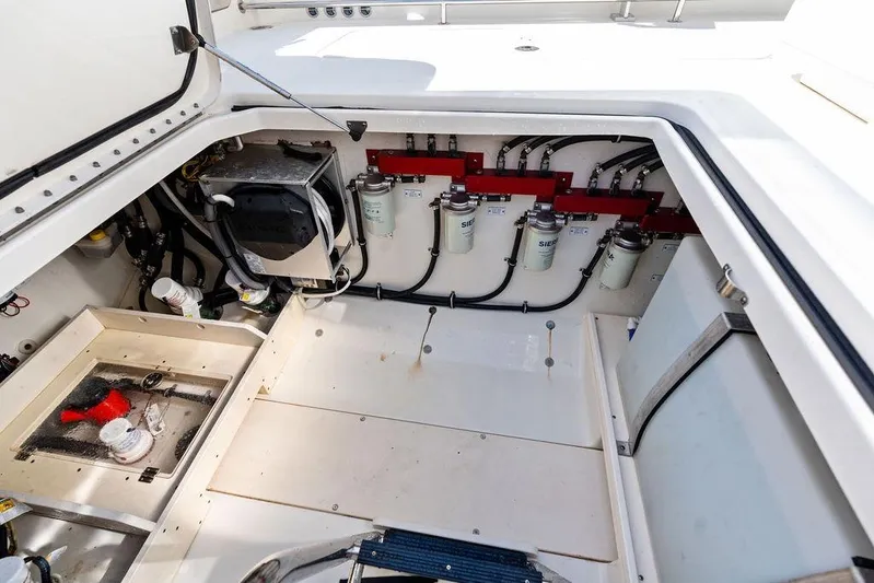 Acevedo Yacht Photos Pics Engine compartment of a 2016 Hydrosport Siesta boat, showcasing fuel filters and wiring.