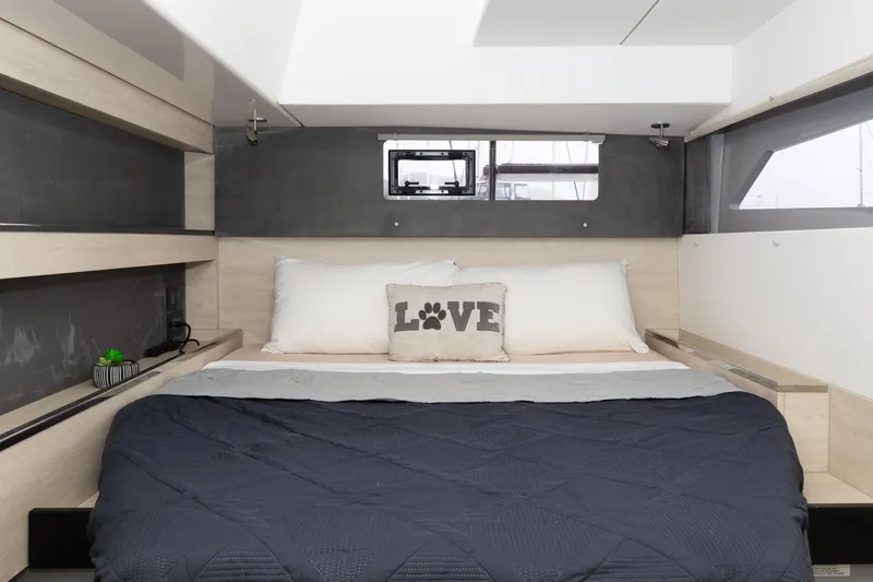  Yacht Photos Pics Cozy bedroom interior in 2021 Leopard 50 yacht with "Love" pillow and modern design.