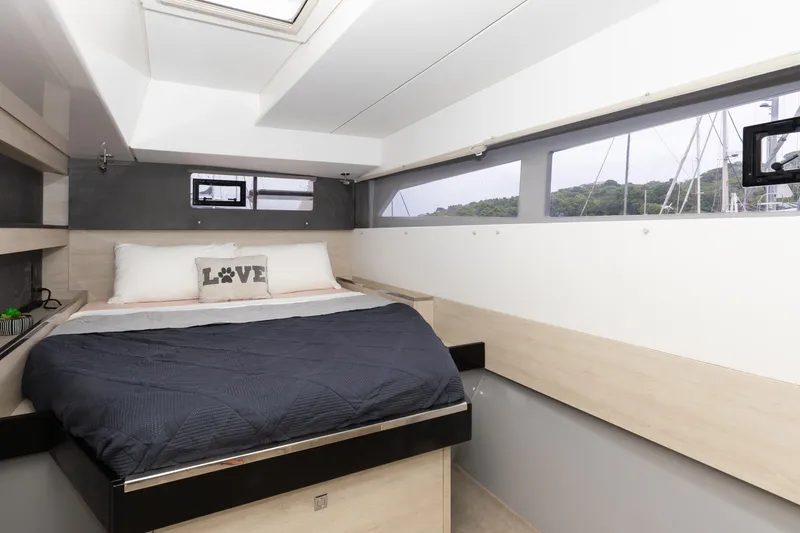  Yacht Photos Pics Luxurious bedroom interior of a 2021 Leopard 50 yacht with modern design and large windows.
