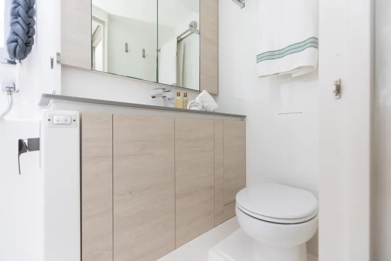  Yacht Photos Pics Modern bathroom in Leopard 50 yacht, featuring sleek cabinetry and elegant fixtures, 2021 model.