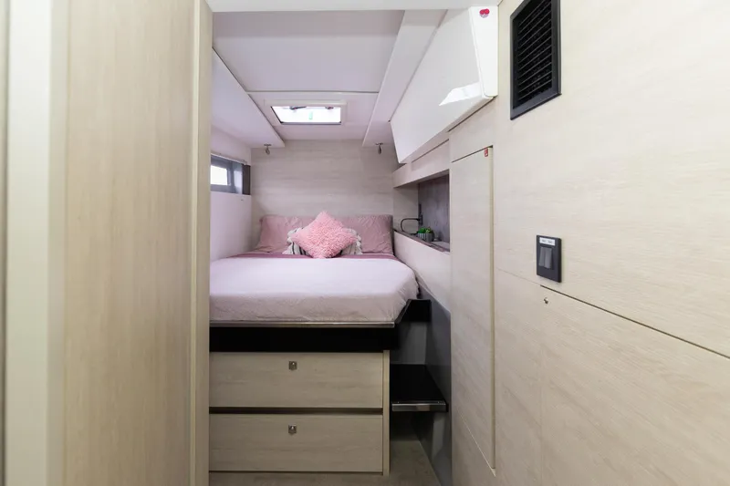  Yacht Photos Pics Cozy bedroom interior in 2021 Leopard 50 yacht with modern design and soft lighting.