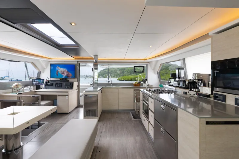  Yacht Photos Pics Luxurious interior of 2021 Leopard 50 yacht with modern kitchen and dining area.