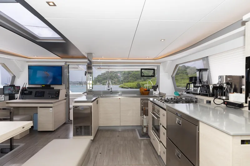  Yacht Photos Pics Luxurious interior of 2021 Leopard 50 yacht with modern kitchen and navigation area.