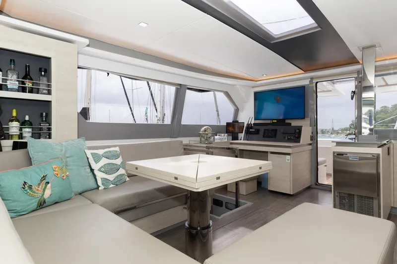  Yacht Photos Pics Luxurious interior of 2021 Leopard 50 yacht with modern seating, table, and entertainment system.