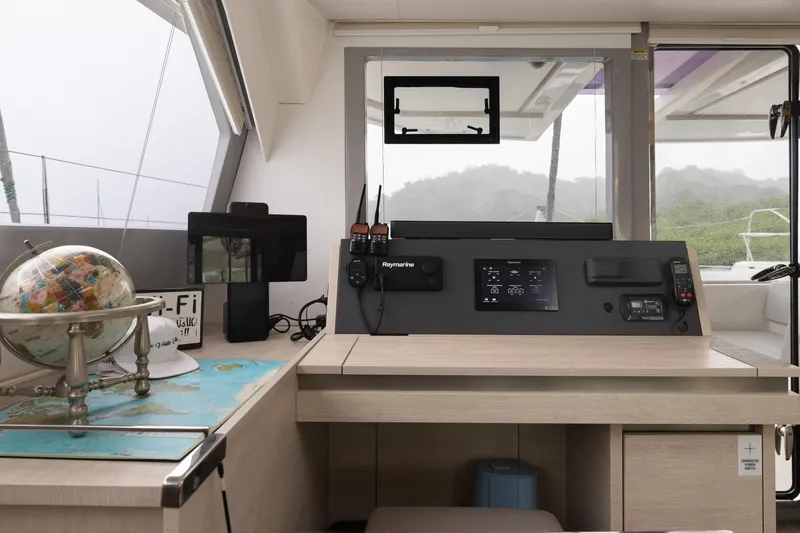  Yacht Photos Pics Modern navigation station on a 2021 Leopard 50 yacht with globe and electronics.