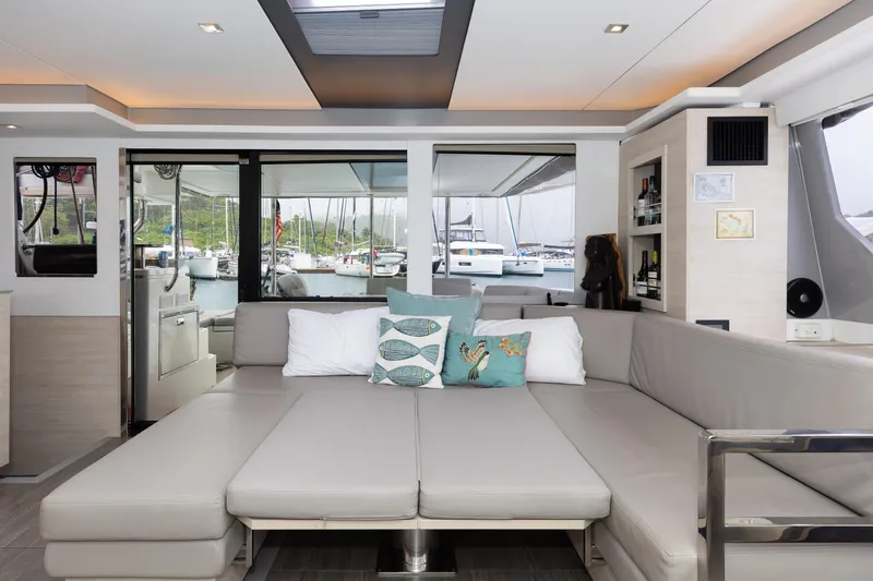  Yacht Photos Pics Luxurious Leopard 50 yacht interior with modern seating and scenic marina view, 2021 model.