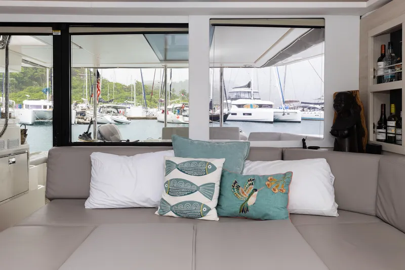  Yacht Photos Pics Interior of 2021 Leopard 50 yacht with decorative pillows and marina view.