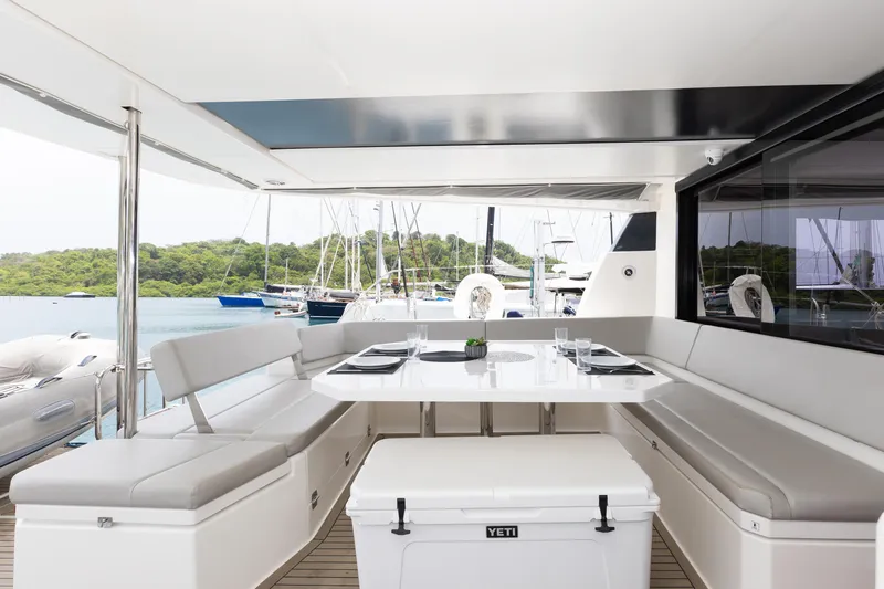  Yacht Photos Pics Luxurious Leopard 50 yacht deck with elegant seating and dining area, 2021 model.
