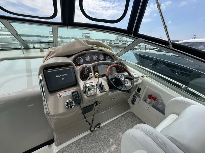  Yacht Photos Pics 2007 Sea Ray 340 Sundancer helm with steering wheel, gauges, and navigation system.