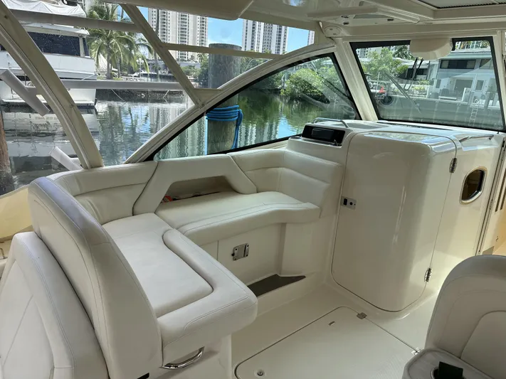 37 Grady White Freedom Yacht Photos Pics 2017 Grady-White Freedom 375 boat interior with white seating and waterfront view.