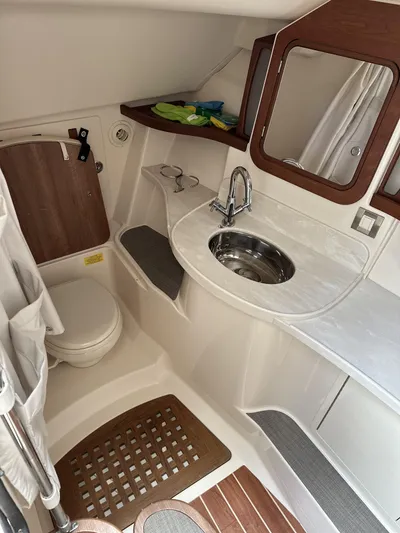 37 Grady White Freedom Yacht Photos Pics 2017 Grady-White Freedom 375 boat bathroom with sink, mirror, and toilet.