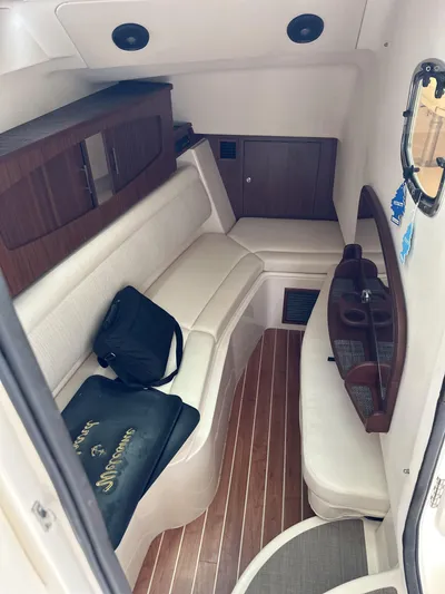 37 Grady White Freedom Yacht Photos Pics 2017 Grady-White Freedom 375 cabin interior with seating and wood accents.