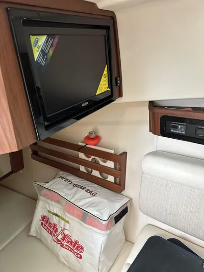 37 Grady White Freedom Yacht Photos Pics Interior of 2017 Grady-White Freedom 375 boat with TV and safety gear bag.