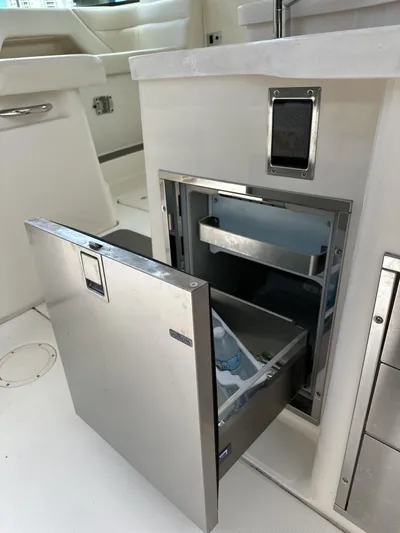 37 Grady White Freedom Yacht Photos Pics 2017 Grady-White Freedom 375 boat interior with open stainless steel refrigerator drawer.