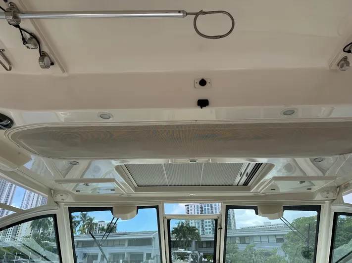 37 Grady White Freedom Yacht Photos Pics Interior view of 2017 Grady-White Freedom 375 boat, showcasing ceiling and windows.