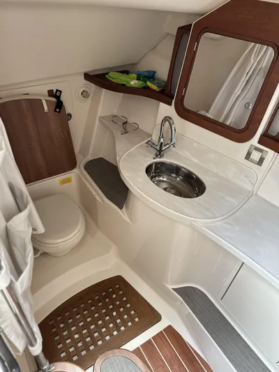 37 Grady White Freedom Yacht Photos Pics 2017 Grady-White Freedom 375 boat bathroom with sink, mirror, and toilet.