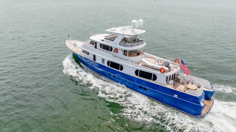 Bravo Yacht Photos Pics Aerial view of 1975 Stephens Brothers Expedition yacht cruising on open water.