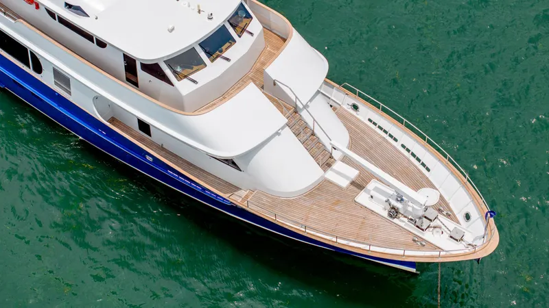 Bravo Yacht Photos Pics Aerial view of 1975 Stephens Brothers Expedition yacht on green water.