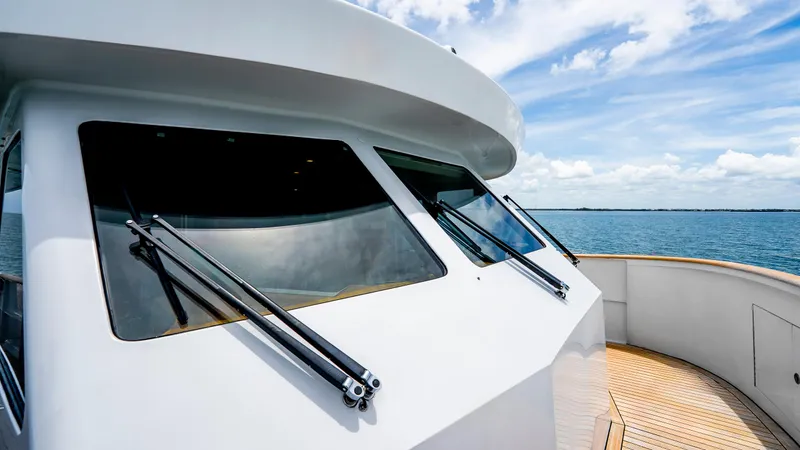 Bravo Yacht Photos Pics 1975 Stephens Brothers Expedition yacht with sleek windows, cruising on a sunny day.