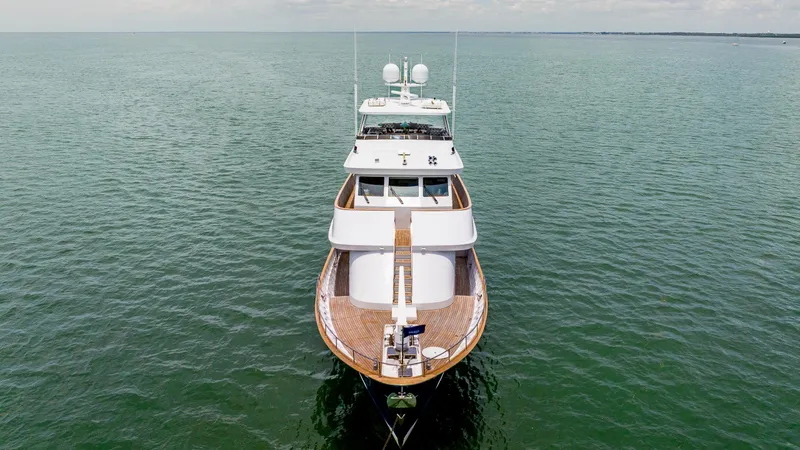 Bravo Yacht Photos Pics 1975 Stephens Brothers Expedition yacht on calm sea, aerial view.