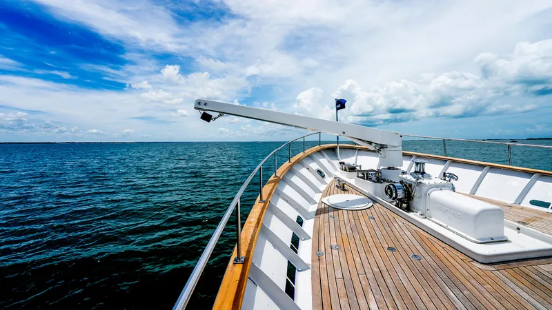 Bravo Yacht Photos Pics 1975 Stephens Brothers Expedition yacht deck with ocean view under blue sky.