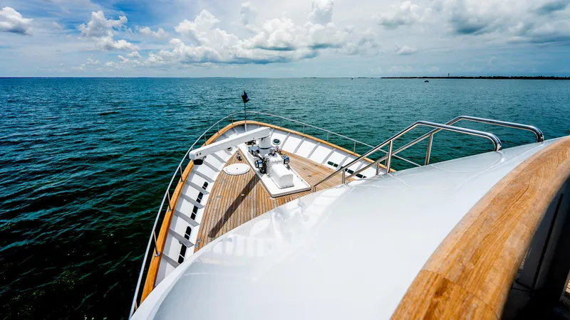 Bravo Yacht Photos Pics Bow of 1975 Stephens Brothers Expedition yacht on open sea under cloudy sky.